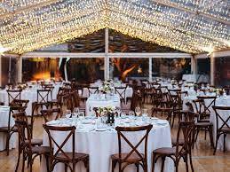 Several empty round tables with chairs
